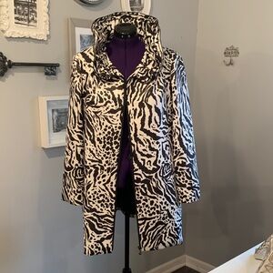 Samuel Dong Black and White Animal Print Coat with ruffle collar.